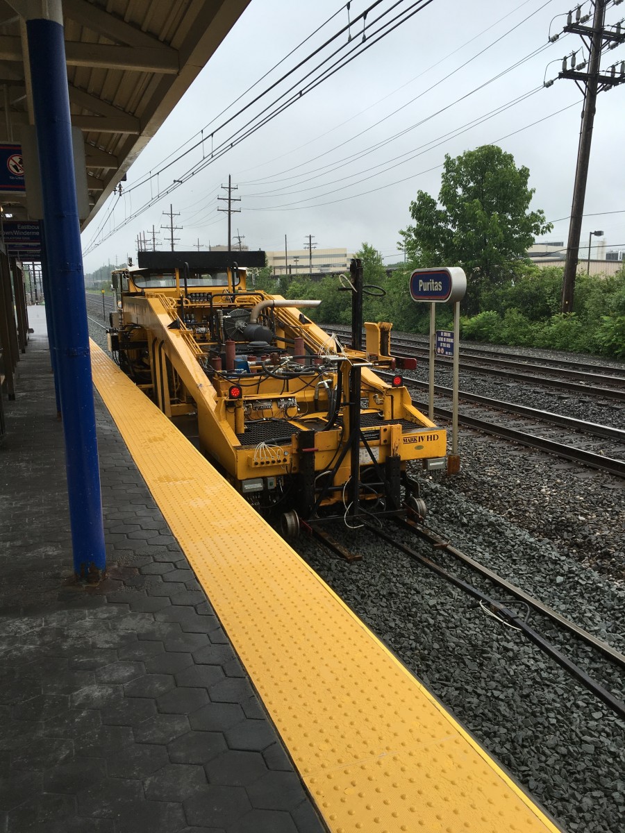 Photos of a ballast tamper and ballast regulator at work