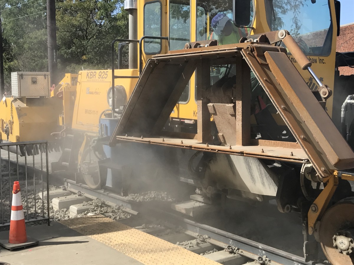 Photos of a ballast tamper and ballast regulator at work