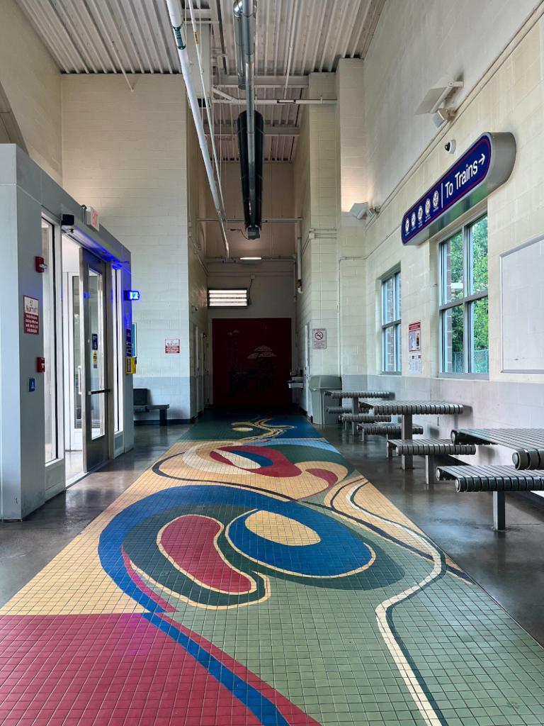 This ecclectic tile mosaic celebrates excellence in creativity in all spheres of educational and community empowerment, advancement, and entrepreneurship in the neighborhood and Cleveland areas.