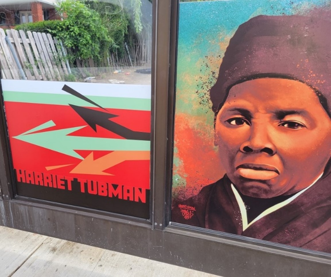 Harriet Tubman Bus Shelter Wrap on E.131 St. at Harvard Avenue, Northbound.