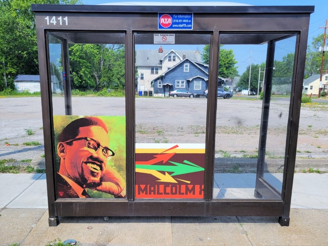 Malcolm X Bus Shelter Wrap on E.131 St. at Harvard Avenue, Southbound.