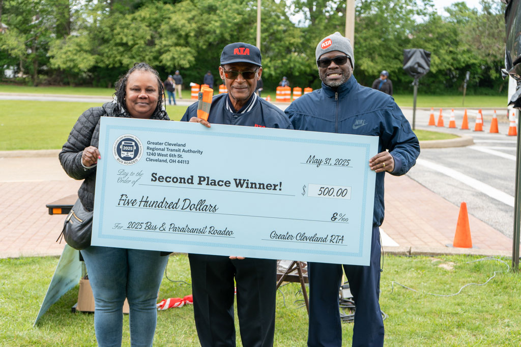 Shawnee’ Hubbard, Paratransit Transportation Manager, and Dr. Floun’say Caver, GCRTA Chief Operating Officer, present Paratransit Operator James “Jimmy” Smith with 2nd place in the 2025 Bus & Paratransit Roadeo, held in June at the West Park Rapid Station.