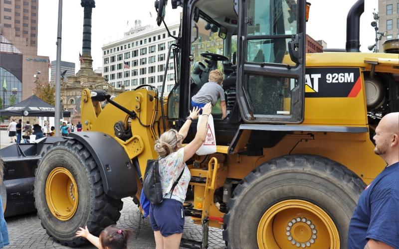 GCRTA staff guiding visitors on the Front-End Loader.