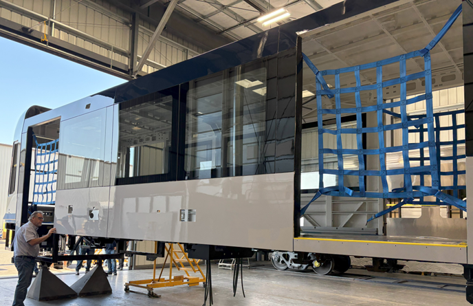 Kenneth Bisson (QA Manager) inspecting the painted carshell during the first article inspection of the painted carshell.