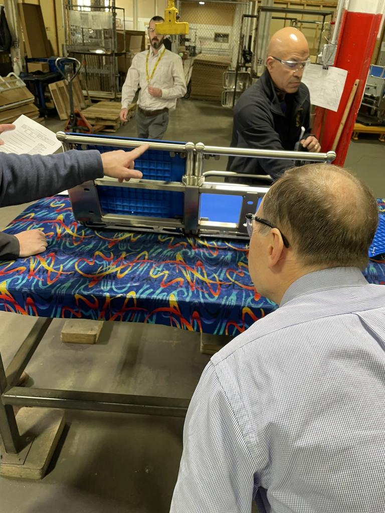 Don Haradem and Bryan Moore inspecting passenger seat, January 2025