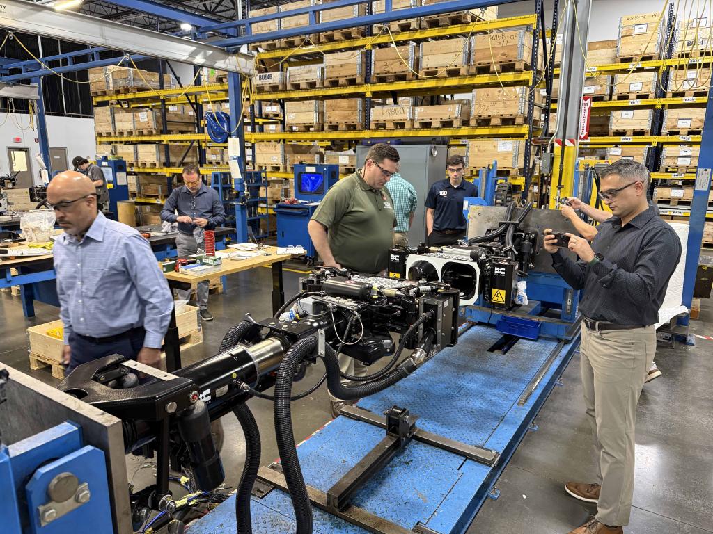Two couplers on an engagement test fixture (Bryan Moore, Casey Blaze, Eddie Lopez (Hatch), and Hamid Moslehi (SMI))