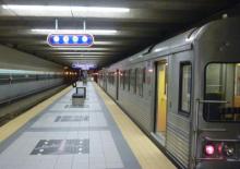 A Red Line train waits at the platform of the Hopkins Airport station.